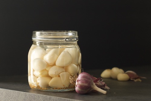 Garlic cloves in an airlock jar for fermented garlic